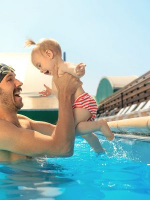 happy-family-having-fun-by-swimming-pool (1)